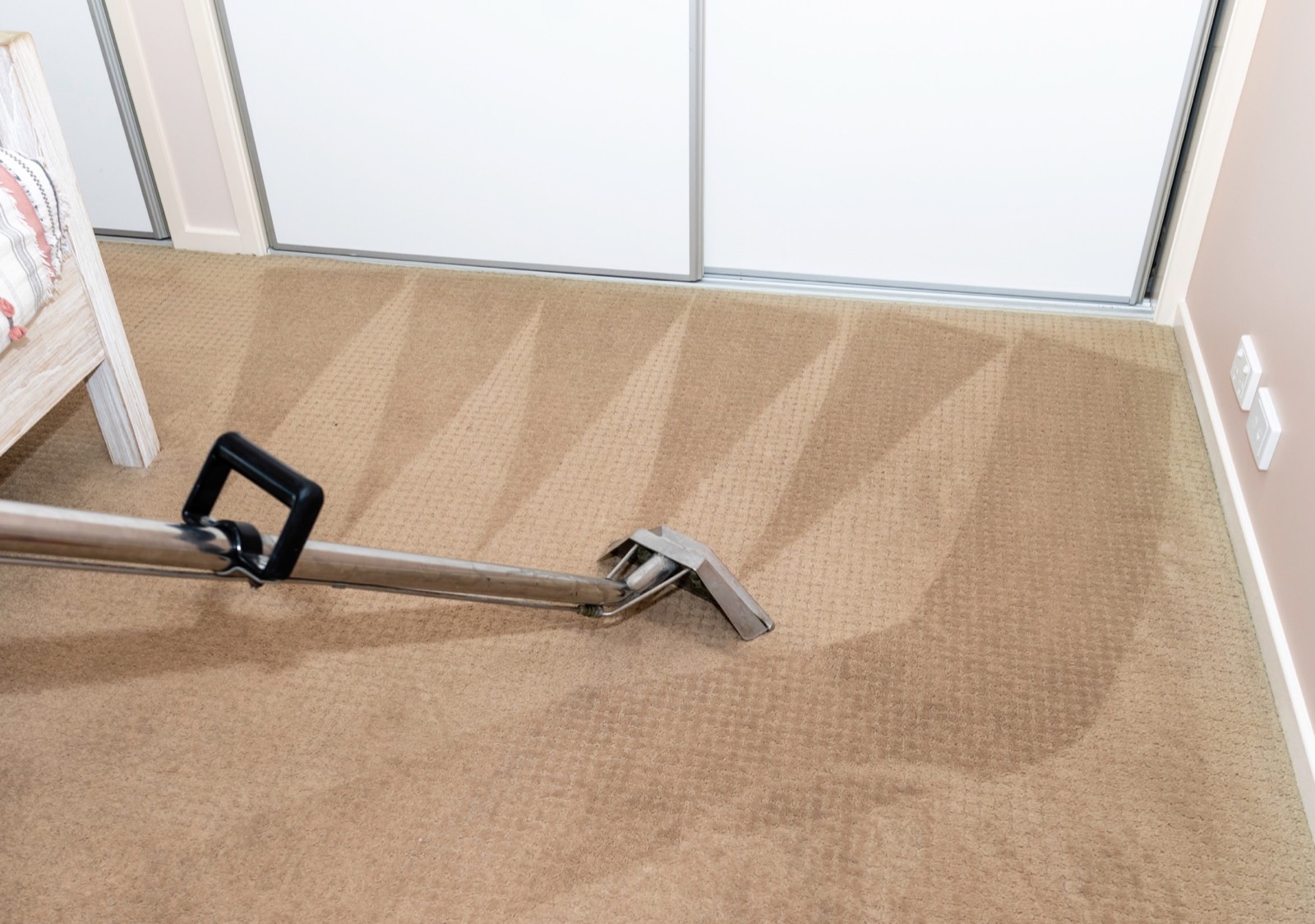 Professional extraction wand leaving a freshly cleaned carpet pile