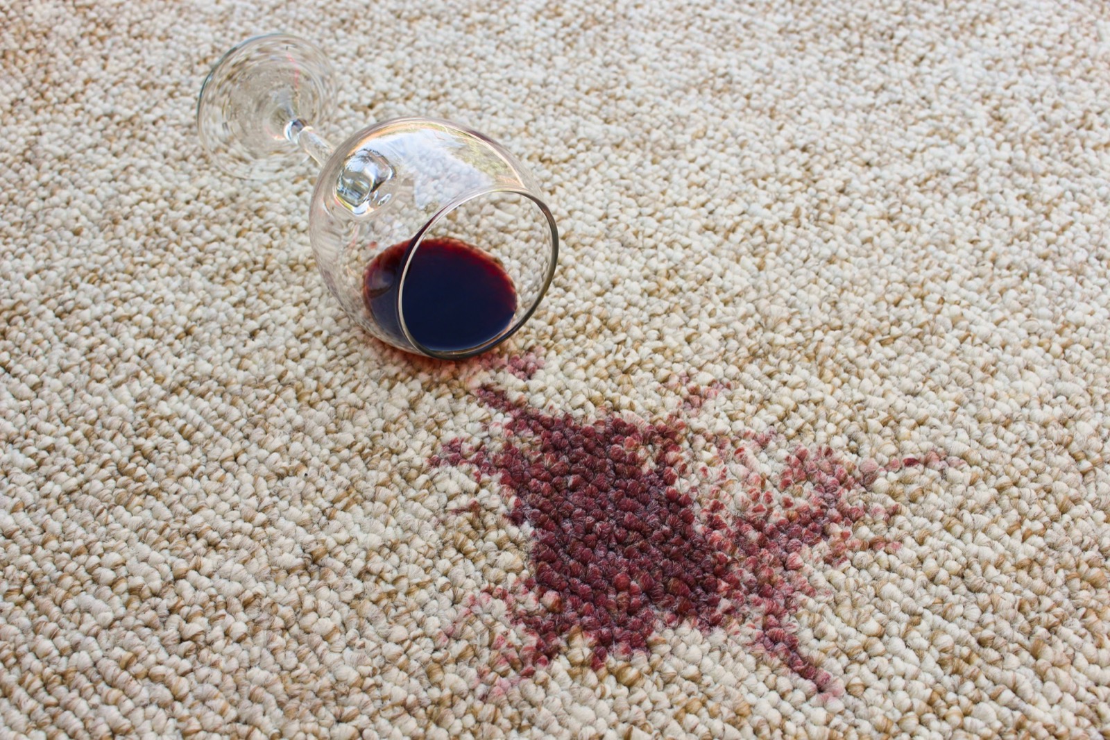 Red wine spill requiring specialist stain removal